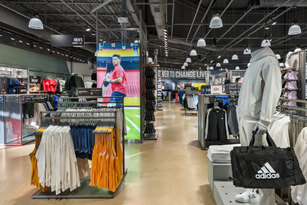 Example of recent retail photography project of an Adidas Outlet Store Retail showing new signage in store.